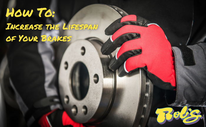 Rob's Auto technician holding brake parts