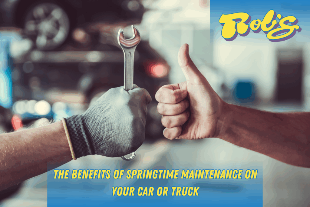 Two hands are put together like a fist bump but have their thumbs up. One hand is of a mechanic and is wearing a glove and has a wrench. They are taking care of their cars!